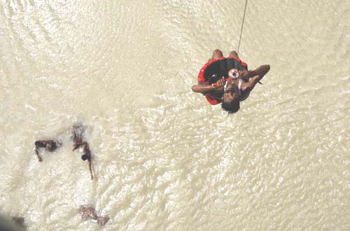 A flood victim being rescued by IAF helicopter in Bihar.